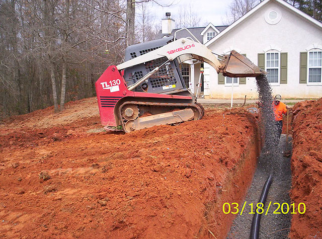Installation of top aggregate layer Northeast Georgia based GSI offers septic system installation, maintanance and repair